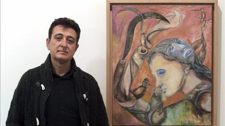 Manolo García junto a una de sus pinturas (ELDIARIO:ES)